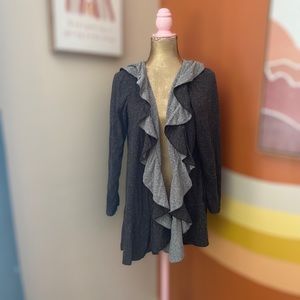 The Pyramid Collection Ruffle Shrug